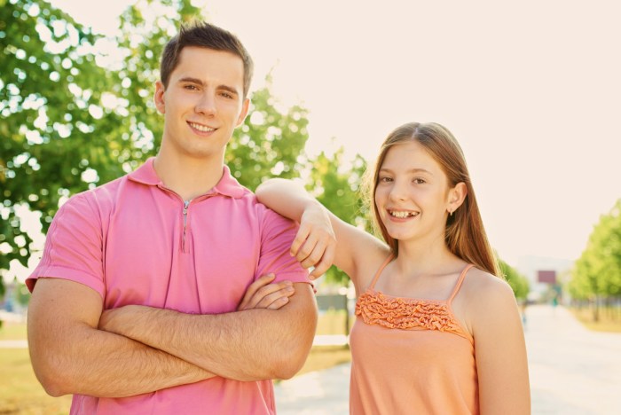 An older sibling stands 12 feet from little brother